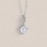 14k white gold-plated Allure necklace featuring a round-cut cubic zirconia crystal suspended from a dainty ribbon-shaped pendant with tiny crystals embedded along one side.