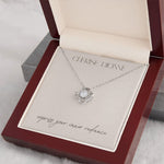 14k gold-plated Radiance necklace packaged in an elegant gift box with a card that features the Cherise Dionne logo and the phrase 'express your inner radiance'.